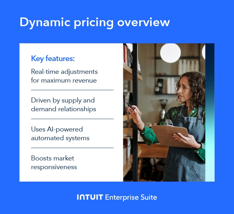 A wedding cake and a laptop on a table.